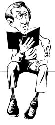 Man with glasses sitting reading a Bible